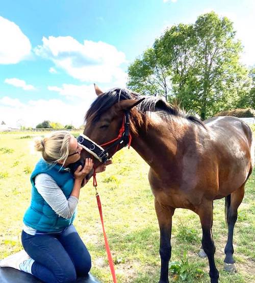 Dr Isabelle Rosser working with her horse, Bolly.